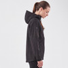 A black softshell jacket with a hood, featuring a logo, displayed on a model from a side profile.