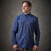 A blue button-up shirt with two chest pockets and a collar, featuring a logo on the front.
