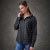 A button-up, long-sleeve women's shirt in dark grey, featuring a collar and a logo.