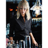 A black button-up women's shirt displayed on a model, with a bar setting and bottles in the background.