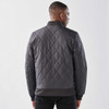 A men's thermal jacket in dark grey with a quilted design and ribbed cuffs. It features a branding logo.
