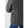 A women's thermal jacket in dark grey featuring a quilted design and side button detail.