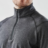 A 1/4 zip pullover in dark grey with a smooth finish and a high collar. Features a branding logo.
