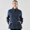A navy softshell jacket with a front zip and side pockets, worn by a woman. The jacket features a logo.