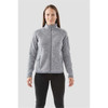 A woman is wearing a grey full zip fleece jacket with a high collar and side pockets. The jacket features a logo.