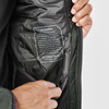 A close-up of a men's thermal jacket in dark green, displaying the inner lining and a label with brand information.