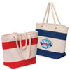 Two cotton canvas tote bags, one with red stripes and the other with navy stripes, featuring a logo on the navy bag.