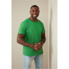 Men's heavyweight green crew neck T-shirt displayed by a smiling man, featuring a logo on the shirt.