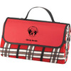 A red and black checkered picnic rug with a carry handle and a logo on the front.