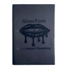 A black refillable journal with a glossy lip graphic and branding on the front cover.