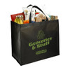 A black jumbo tote bag filled with assorted groceries, including fruit, snacks, and bread, featuring a logo.