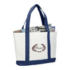 A large white tote bag with navy blue handles and bottom, featuring a decorative logo and filled with magazines.