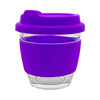 A reusable coffee cup with a clear glass body and a vibrant purple silicone sleeve and lid. It features branding.