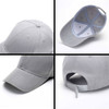 A grey heavy acrylic cap featuring a curved brim, six panels, and an adjustable strap at the back.