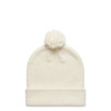 A cream-coloured beanie with a fluffy pom-pom on top, featuring a rolled cuff and a logo.