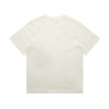 A heavy faded tee in a light cream colour, featuring a simple design and a logo on the label.