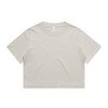A light beige cropped t-shirt featuring short sleeves and a round neckline. The shirt has a simple design and a logo.