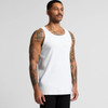 A man models a white organic rib singlet, featuring a simple design and a logo on the fabric.