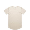 A beige Staple Curve Tee featuring a rounded hem and short sleeves, with a small logo on the neckline.