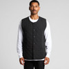 A quilted vest in black, featuring a button-up front and a simple design, worn over a white long-sleeve shirt.