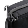 A black toiletry bag featuring a zipper closure and a detachable shoulder strap with a clip.