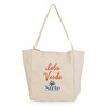 A beige tote bag with a logo and the text "Isla Verde" in orange and blue.