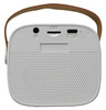 A white mini speaker with a brown strap, featuring ports and a perforated speaker grille.