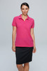 A woman in a bright pink polo shirt paired with a black skirt, featuring a logo on the shirt.