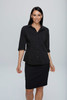 A black button-up shirt with 3/4 sleeves, modelled by a woman, paired with a black skirt. The shirt features a logo.
