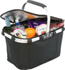 A black picnic cooler bag with a silver handle, filled with drinks, snacks, and an orange, featuring a logo.
