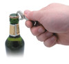 A drink bottle being opened with a silver DIY keyring bottle opener held by a hand. The bottle has a green glass body.