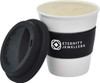 A ceramic coffee mug in white with a black silicone sleeve and lid, featuring a logo.