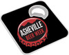 A drink bottle opener-coaster in black with a circular red and white cap design featuring a logo.