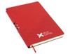 A red A5 notebook with a smooth cover, featuring a logo and a ribbon bookmark.