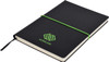 A black A5 notepad with a green elastic band and logo on the cover. Features blank pages inside.