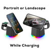 A magnetic wireless charger in black, featuring a multi-colour light base and supporting portrait or landscape phone positioning.
