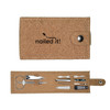 A cork manicure set featuring scissors, nail clippers, tweezers, nail files, and a snap closure.