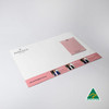 A3 magnetic whiteboard in white featuring a pink notepad, with a logo and branding on the bottom section.