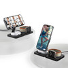 A black multi-device charger with slots for a smartphone and smartwatch, featuring an upright phone holder.