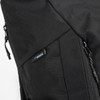 A black roll-up computer backpack featuring detailing and a logo on the side. Zippers are visible for secure closure.