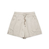 A pair of beige sports shorts with an elastic waist and side slits. The shorts have a logo on them.