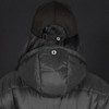 A black puffer jacket with a hood, worn by a person wearing a black cap, featuring a logo on the back.