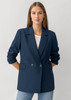 A women's navy double-breasted longline jacket with long sleeves and side pockets.
