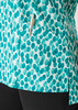 A tunic featuring a teal stardust print, with a pocket and a pen holder detail, set against a light background.