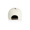 A two-tone cap in cream with a brown adjustable strap at the back and a button on top.