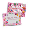 A5 message card featuring a pink background with colourful lollipops and candies, along with a logo.