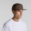 A brown 7-panel cap with a structured design, featuring a flat brim and a logo on the side.