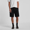 Cargo walk shorts in black, featuring side pockets and a drawstring waist, displayed on a model.