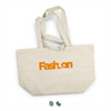 A large beige tote bag with orange branding and two sturdy handles. Features a logo on one side.