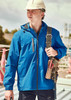 A blue unisex super light packable rain jacket worn by a person with a hard hat, holding a tool belt.